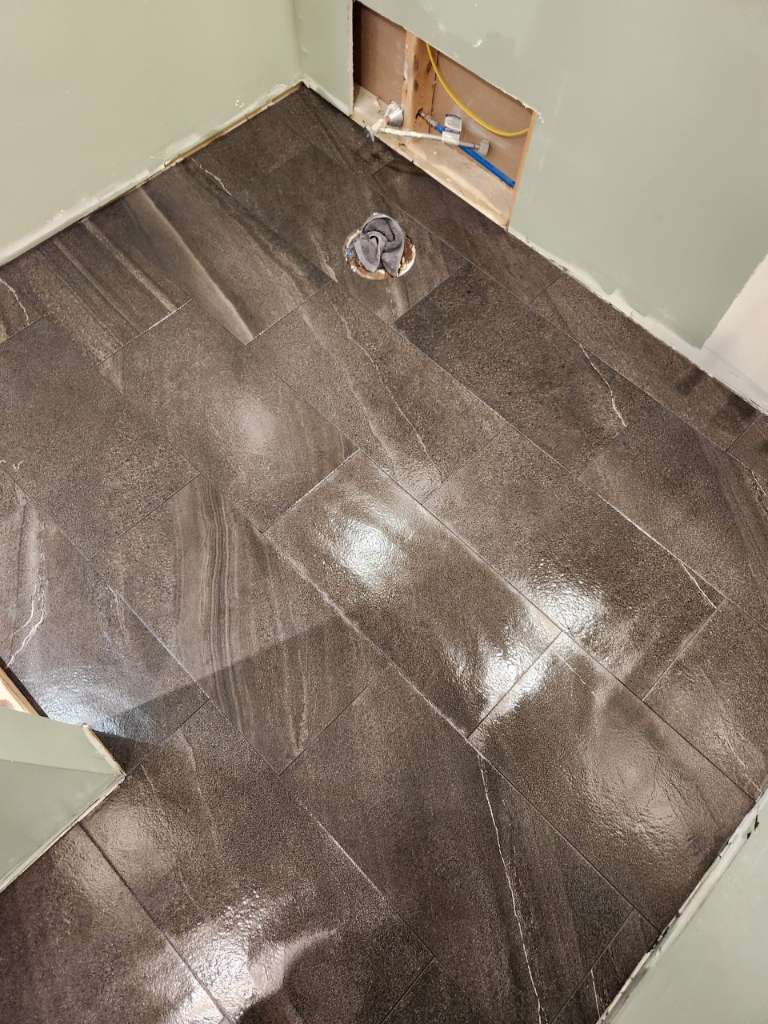 Slate floor tile progress winter construction custom bathroom maine