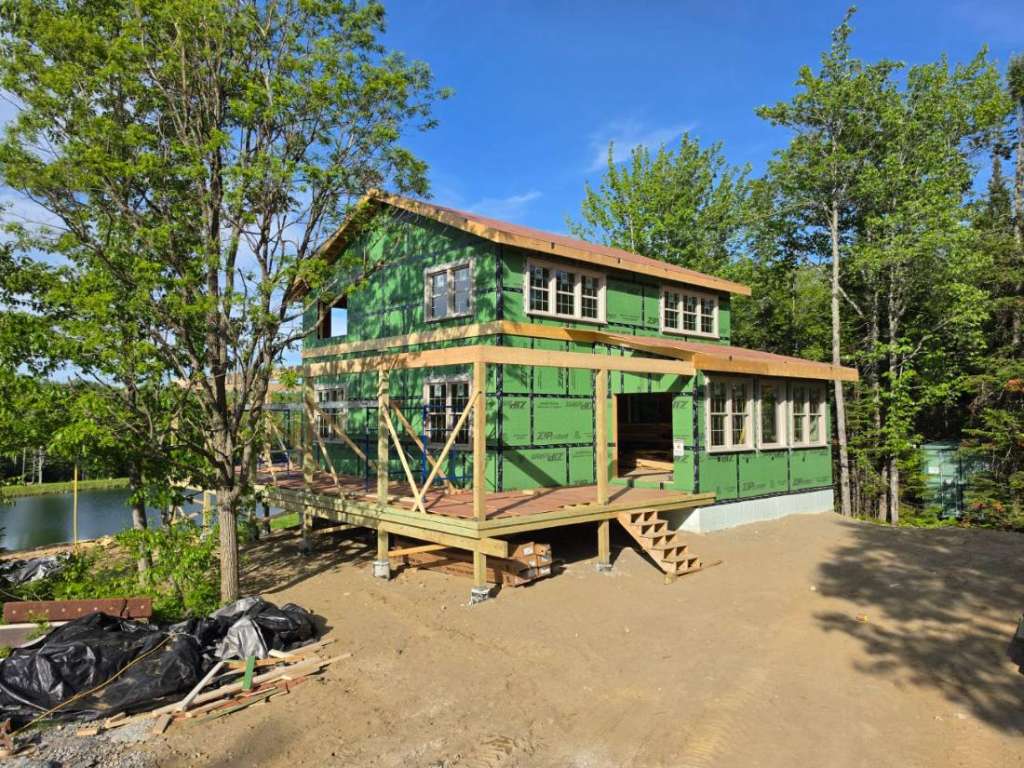 Exterior weatherization rear elevation winter construction phillips maine