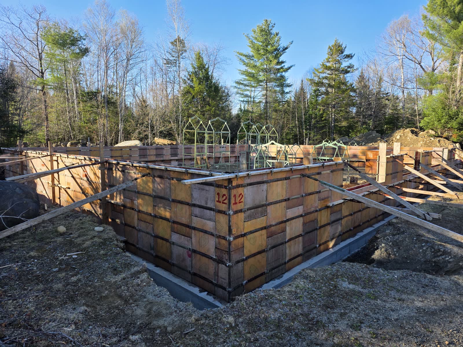 Foundation wall forms set at a Winter Construction garage build in Western Maine