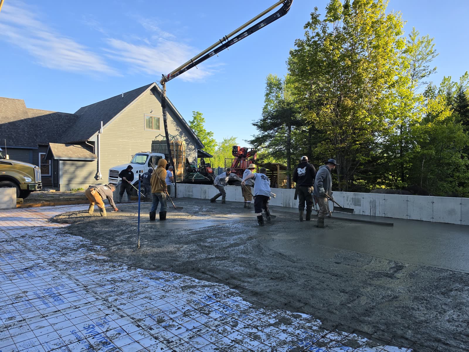 Pouring the slab at a Winter Construction garage build in Western Maine