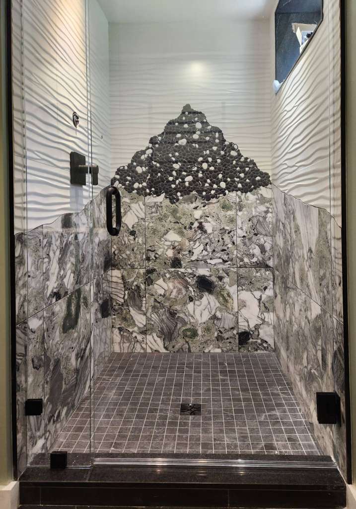 Pebble mosaic marble shower tile finish work winter construction maine