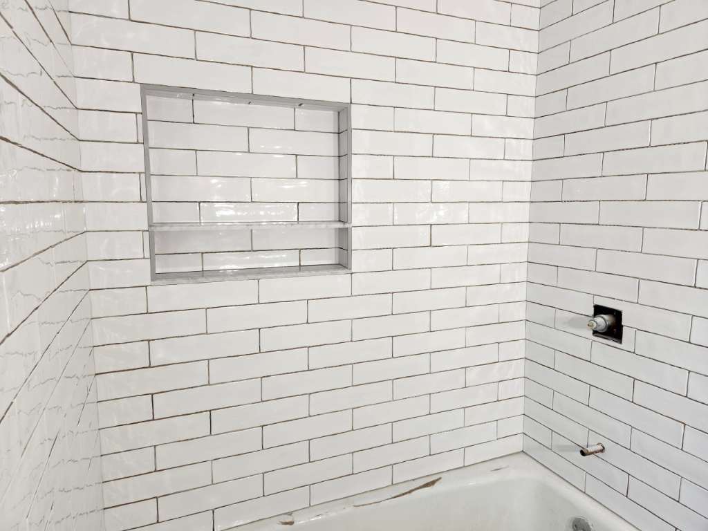 Tiled shower niche detail winter construction bathroom remodel maine