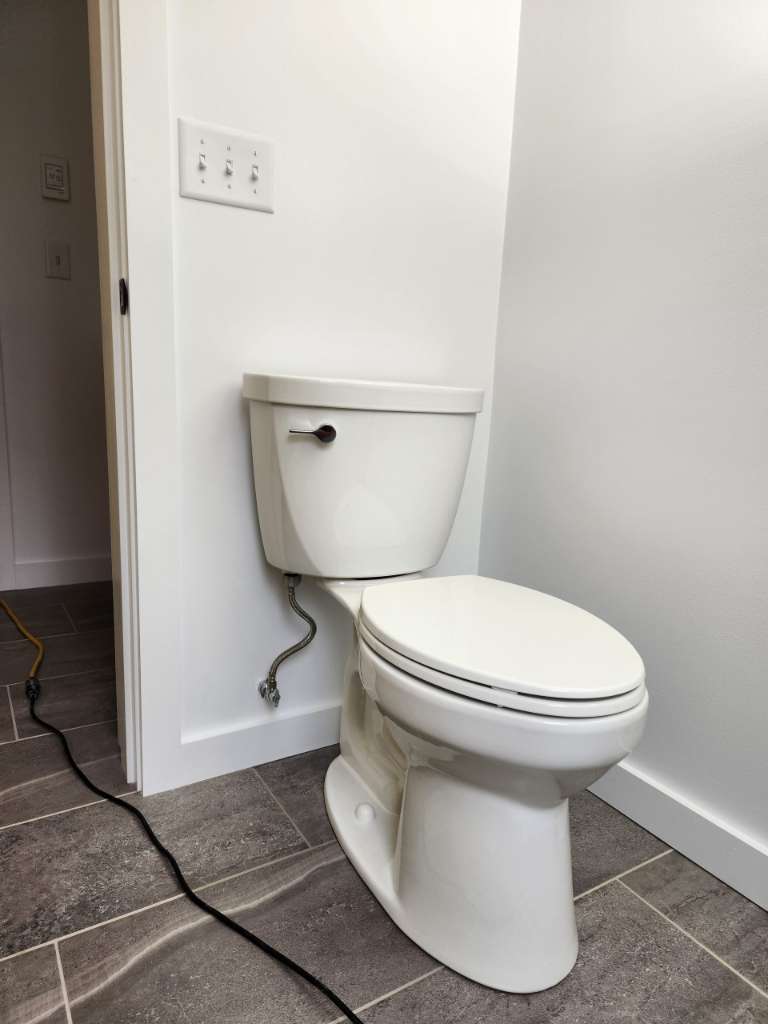 Finished bathroom toilet floor winter construction bathroom remodel maine