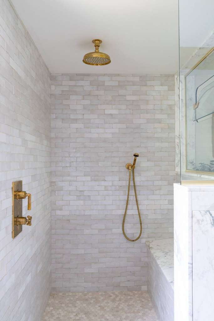 Walk in marble shower brass fixtures winter construction phillips maine